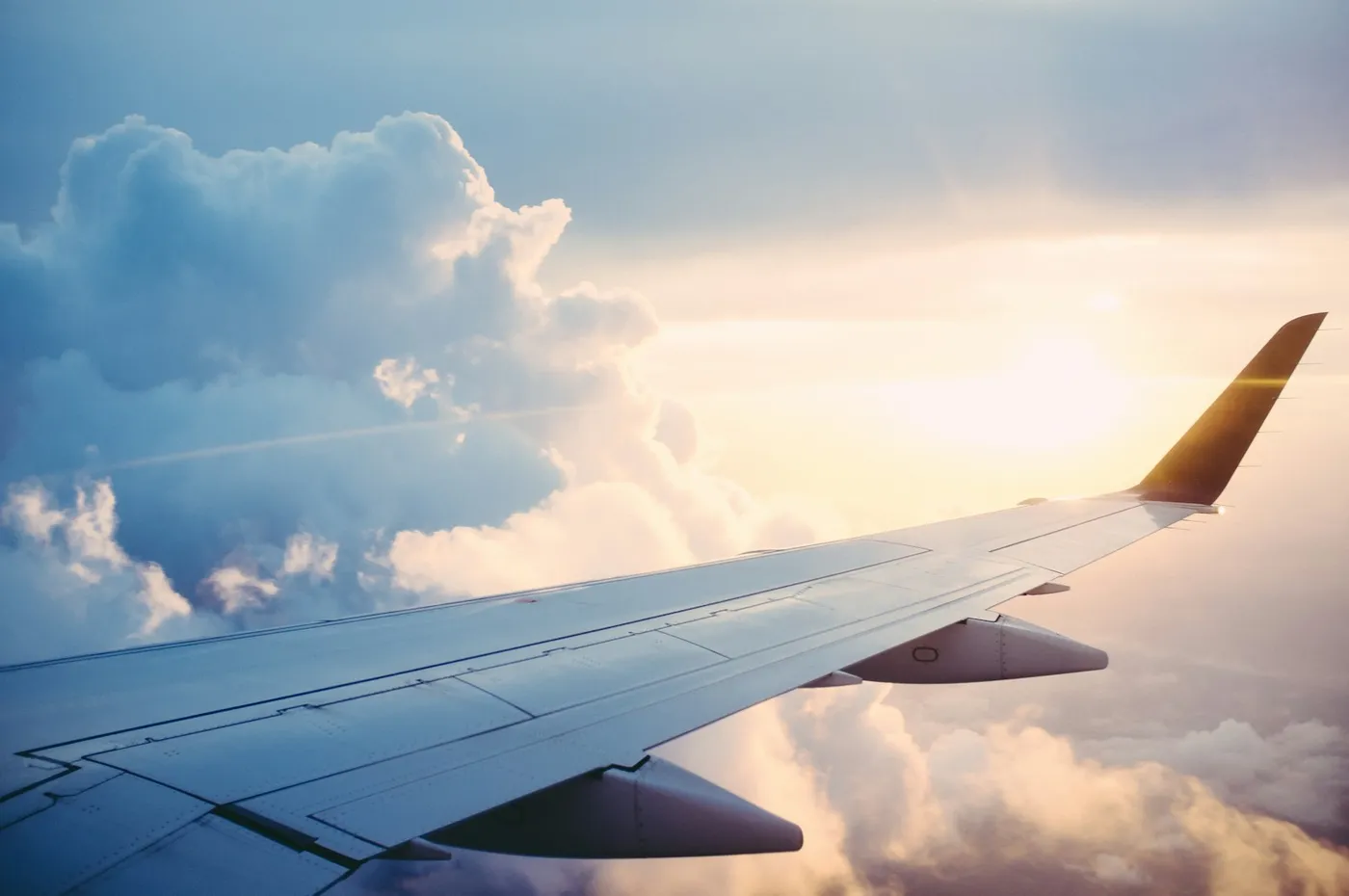 Aircraft wing above a mountainous regional landscape
