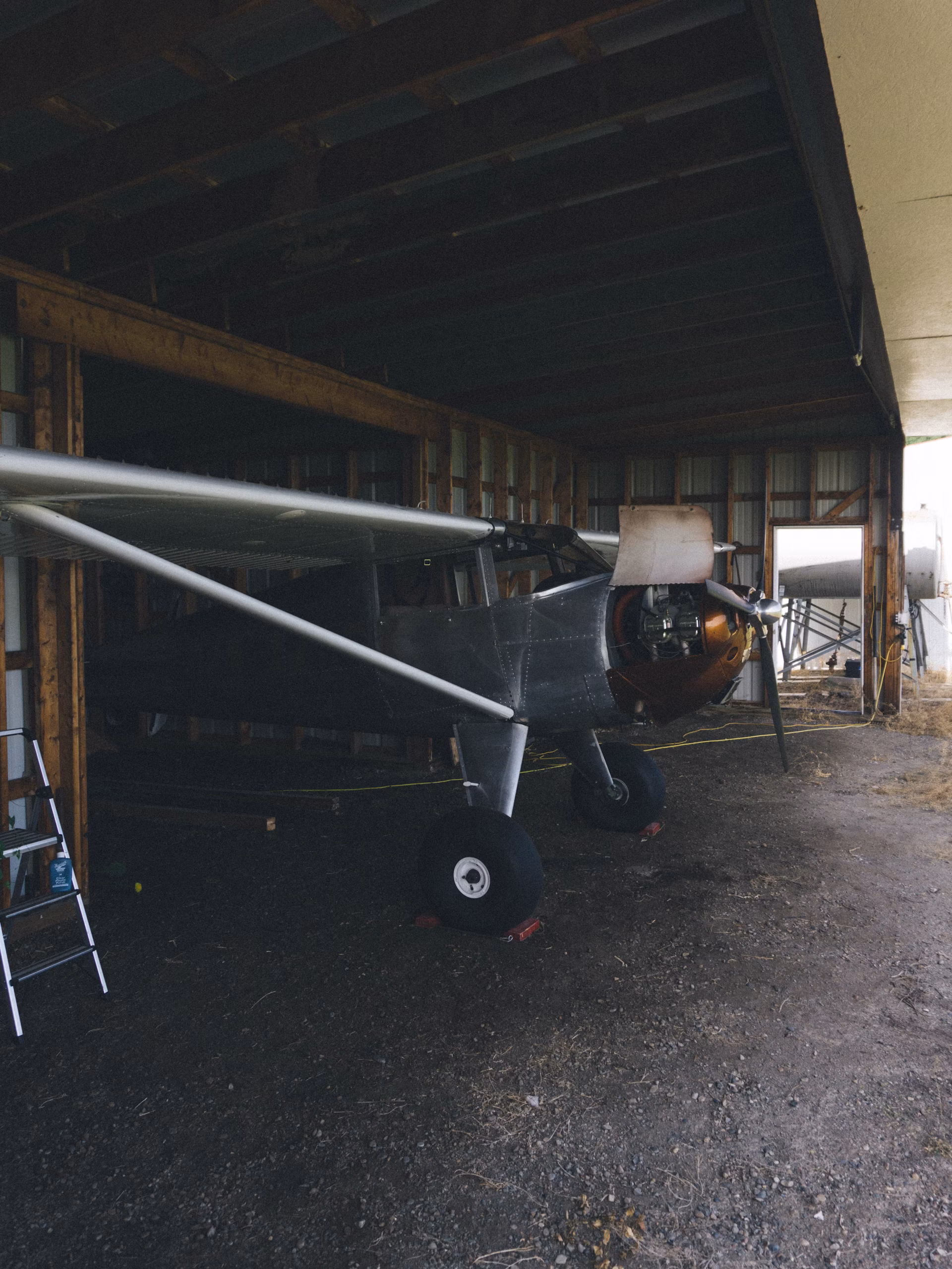 Aircraft parked inside a maintenance hangar